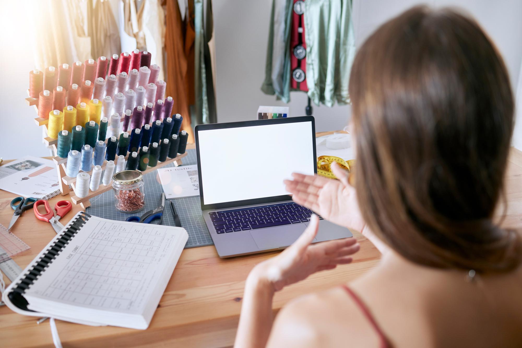 Compact pricing visual with embroidery tools and laptop